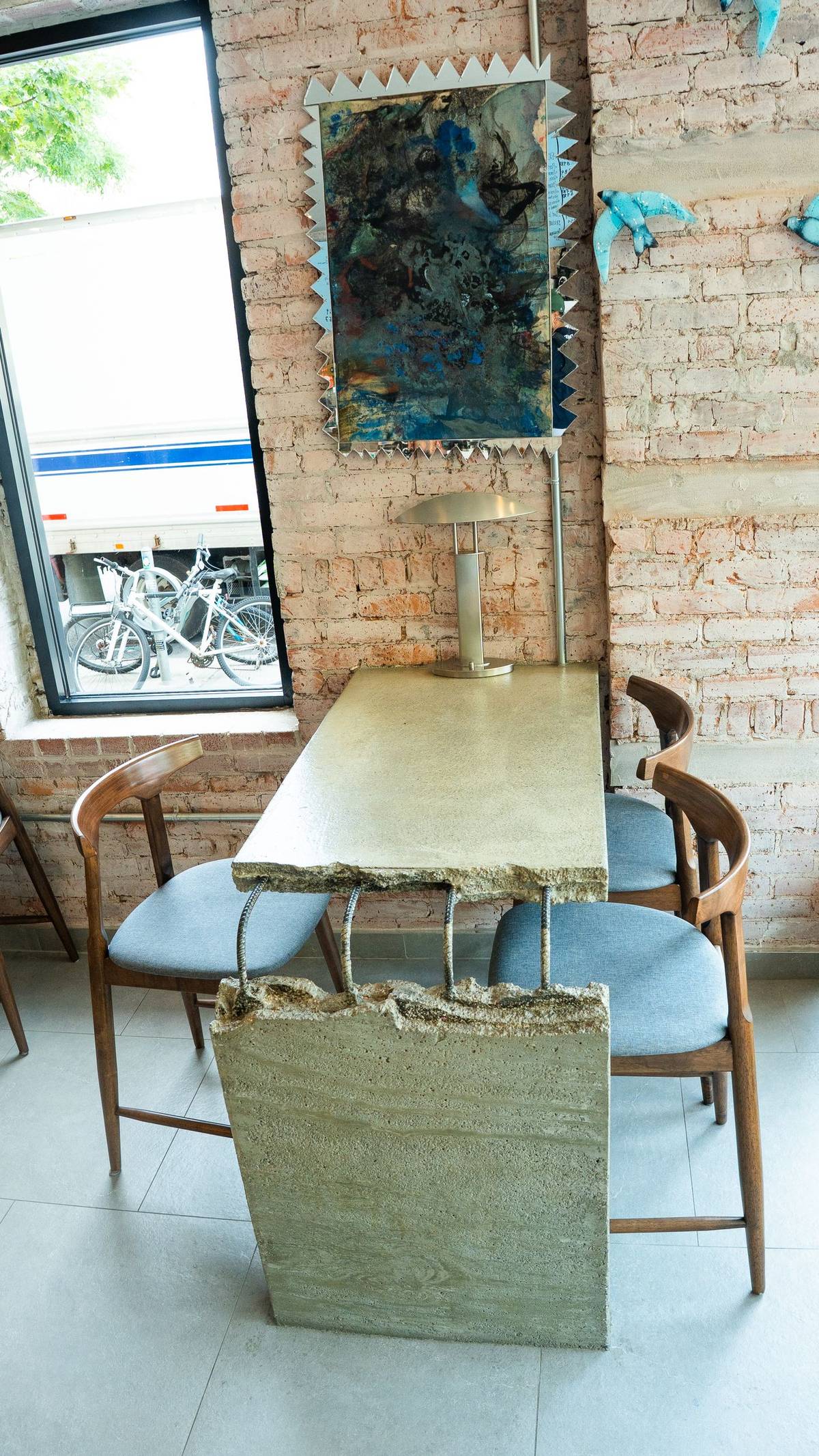 A quiet corner with local art, café side