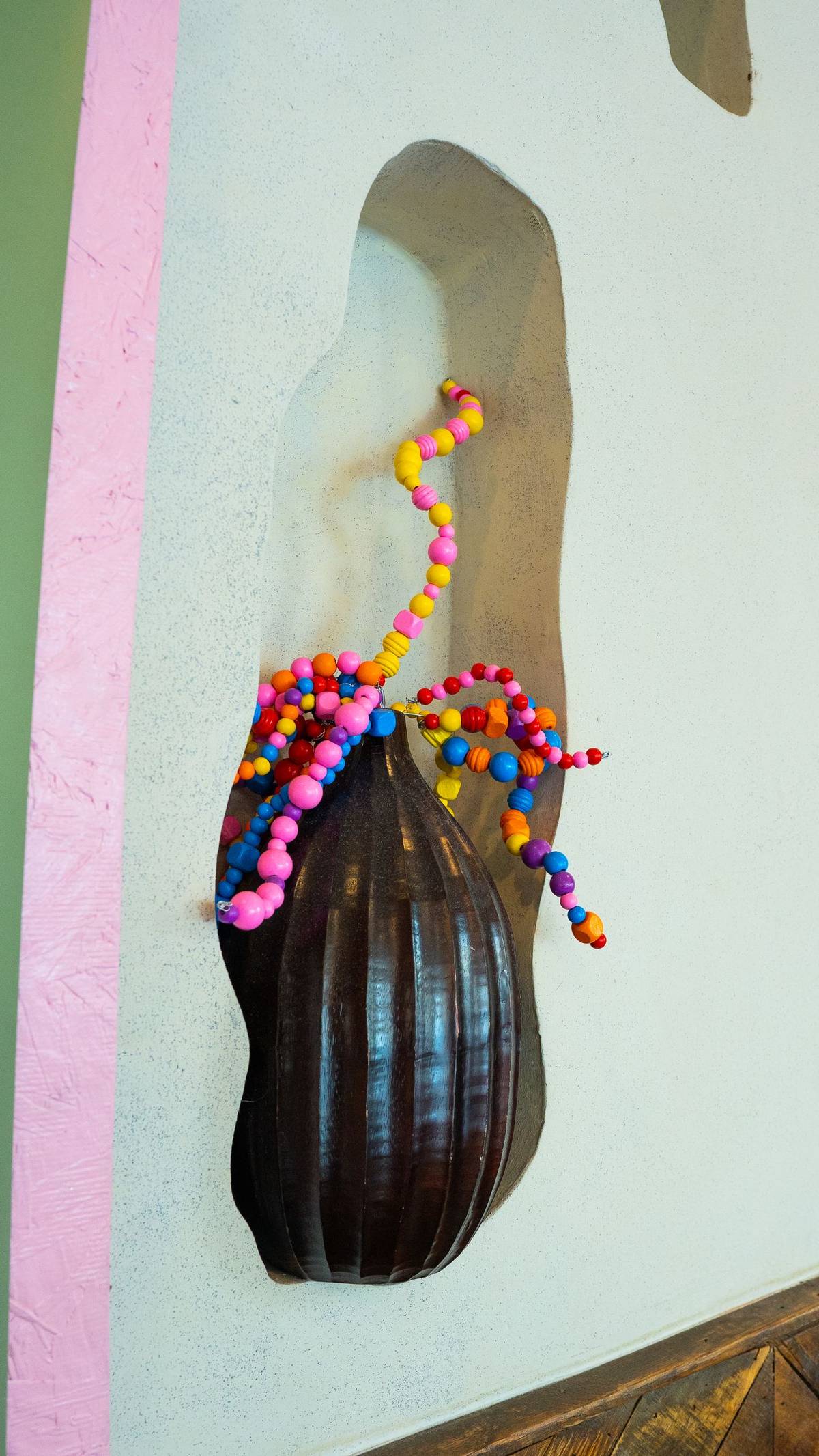 Hand-strung bead art in the wall niches