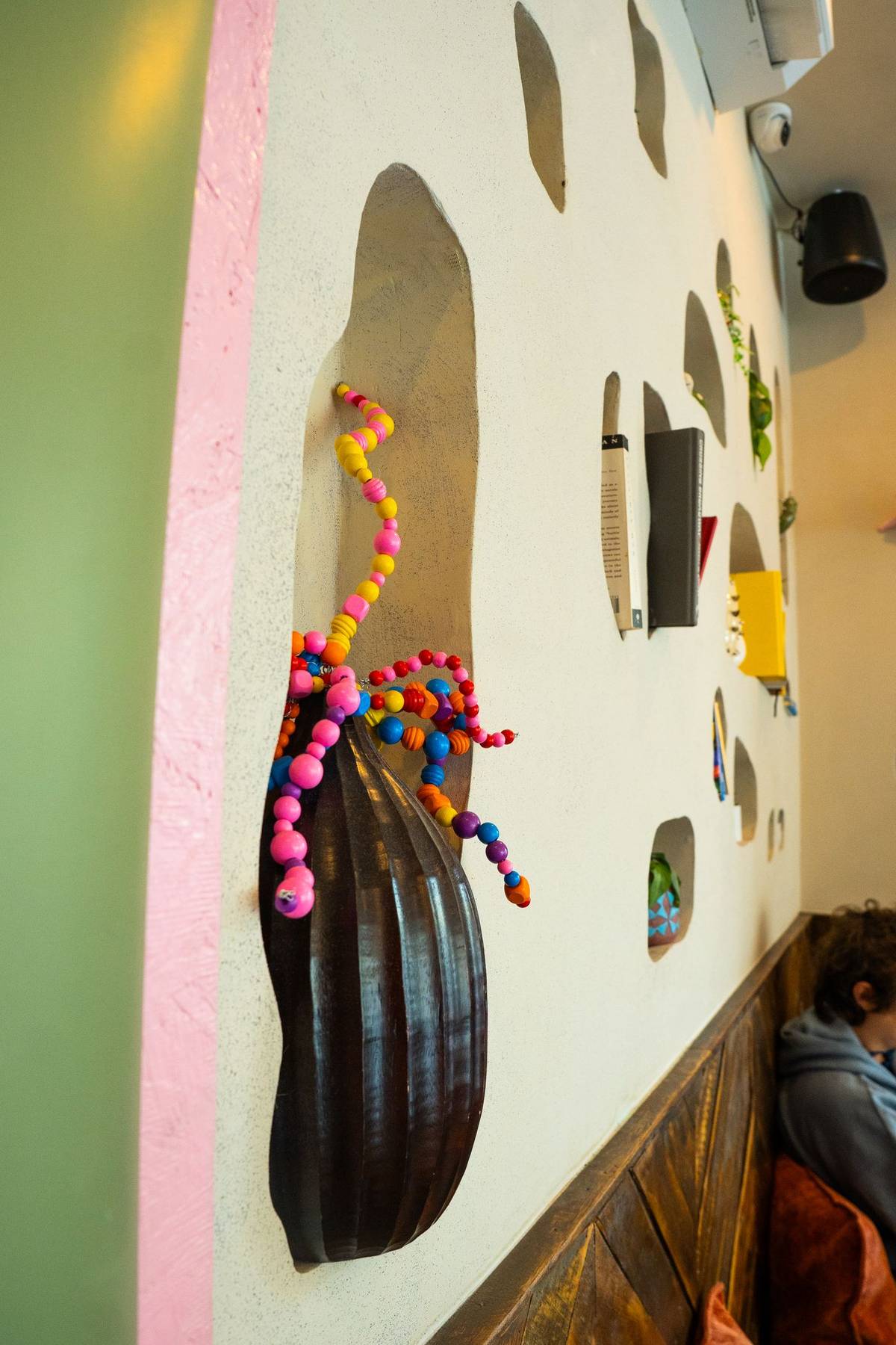 Books and beads tucked into the wall