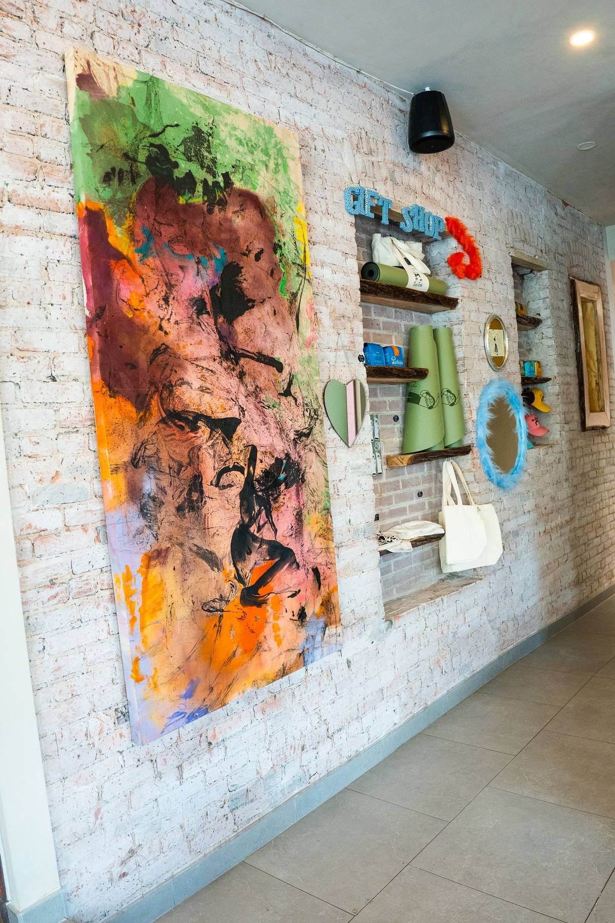 Brick hallway with local art and the gift shop nook